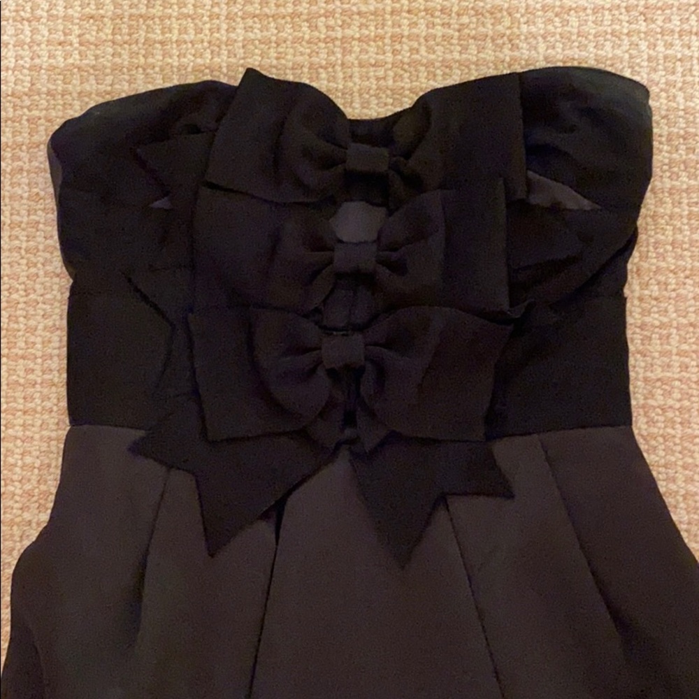 Black strapless mini dress with three black bows